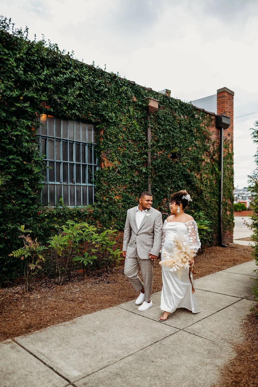 Industrial-chic wedding venue at Studio 215 near Fort Bragg, NC, featuring a luxury bridal suite, exposed brick walls, and modern warehouse charm for ceremonies and receptions.