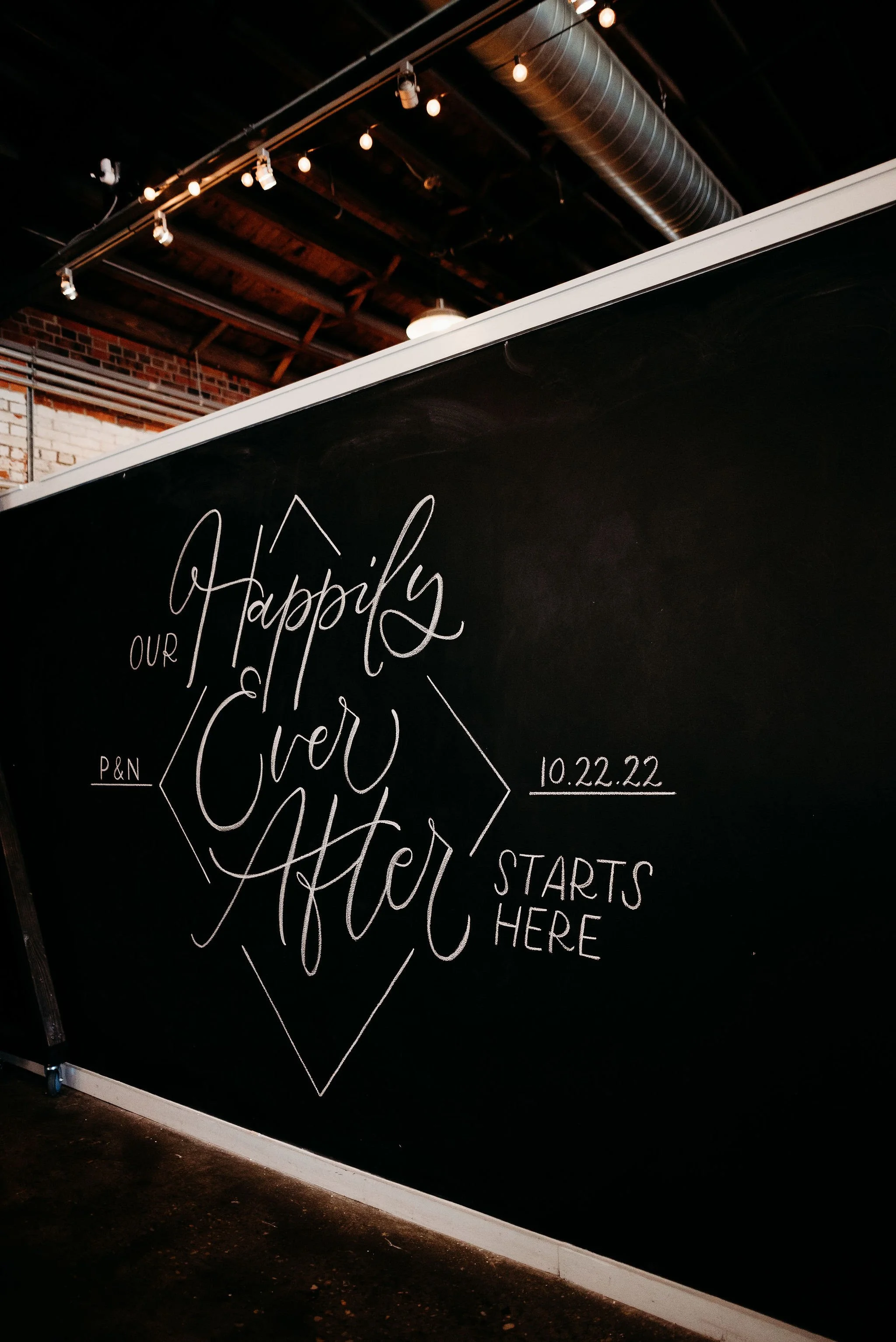  Industrial warehouse wedding and event venue at Studio 215  featuring original exposed brick and modern chic decor; the premier "no-barn" event space near Raleigh and Fort Bragg, in Fayetteville, NC