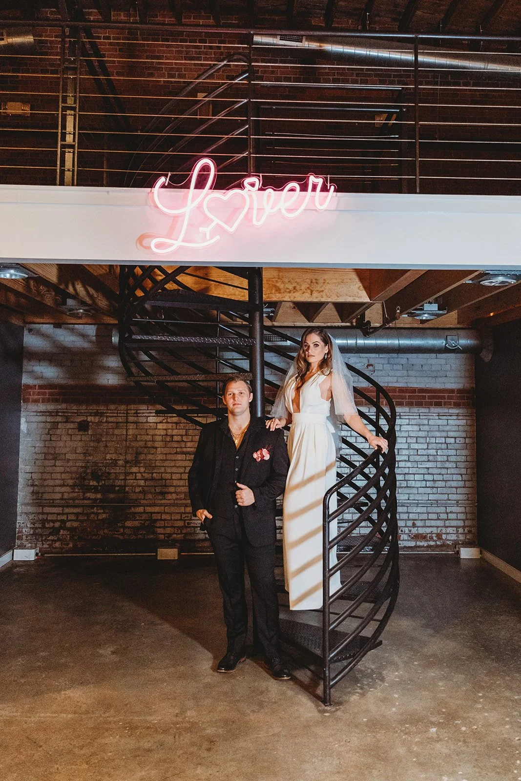 Industrial-chic wedding venue at Studio 215 near Fort Bragg, NC, featuring a luxury bridal suite, exposed brick walls, and modern warehouse charm for ceremonies and receptions.