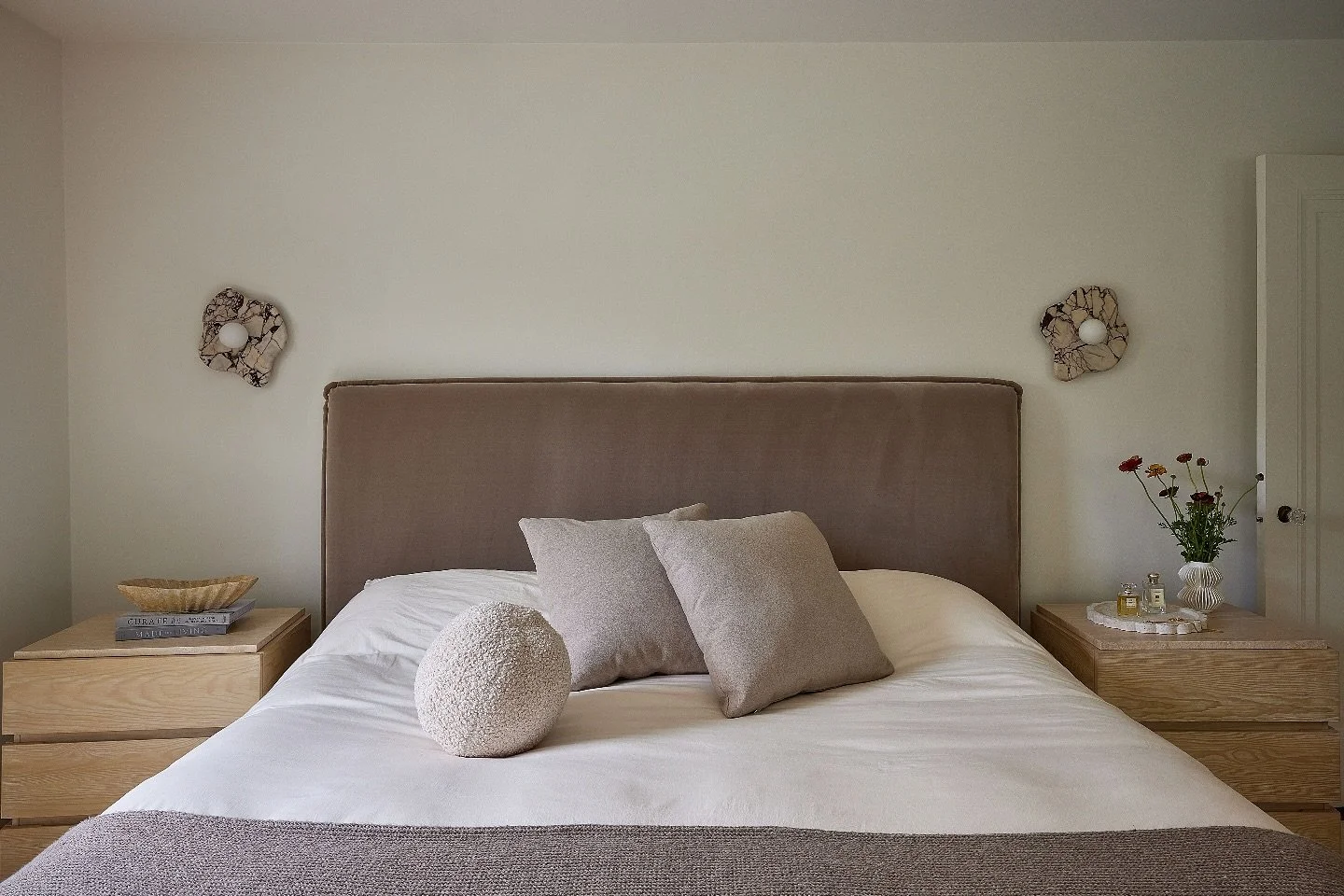 Neutral palette, subtle textures, and sculptural details bring calm and quiet luxury to our primary &bull;
Design by @kelseydeirdredesigns 
Photo by @juliadags 

#InteriorDesign #WarmMinimalism #BedroomInspo #NeutralBedroom