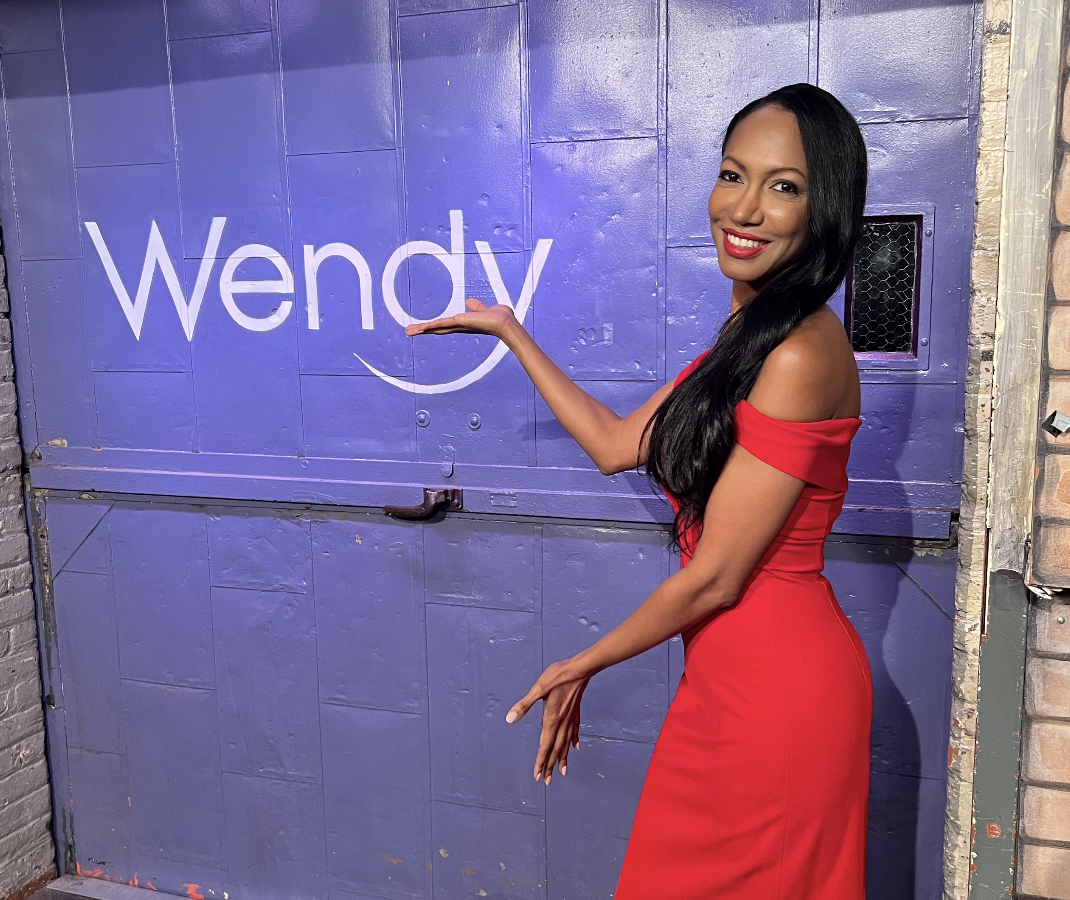Dr. Judith Joseph with the Wendy Show Sign