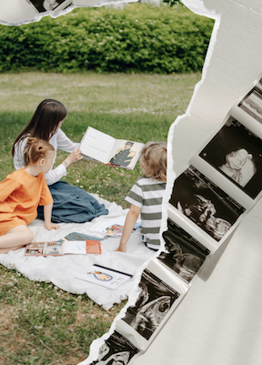 Mother reading with two children on a picnic blanket outdoors, beside a strip of ultrasound scans, illustrating the joy of family life made possible through egg donation and IVF.