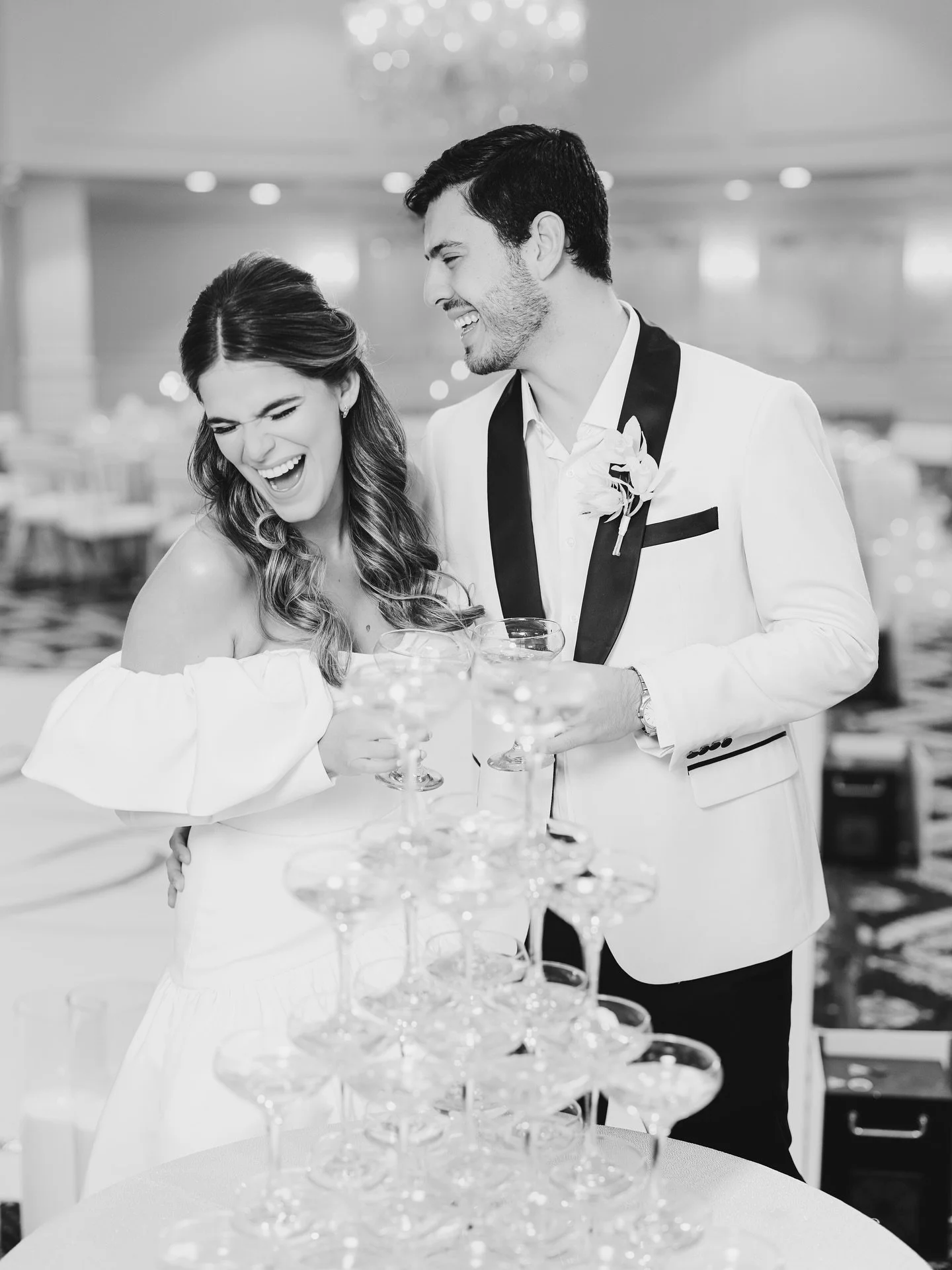 Forget the perfect pose &mdash; this is the real magic: laughter, love, and a whole lot of bubbly.🤍🤍🤍 ⠀
__________ ⠀
*Credits* ⠀
Wedding Planner: @gc.eventsmiami ⠀
Photographer &amp; Videographer: @laviestudiosweddings ⠀
Venue: @trumpdoral @trumpd