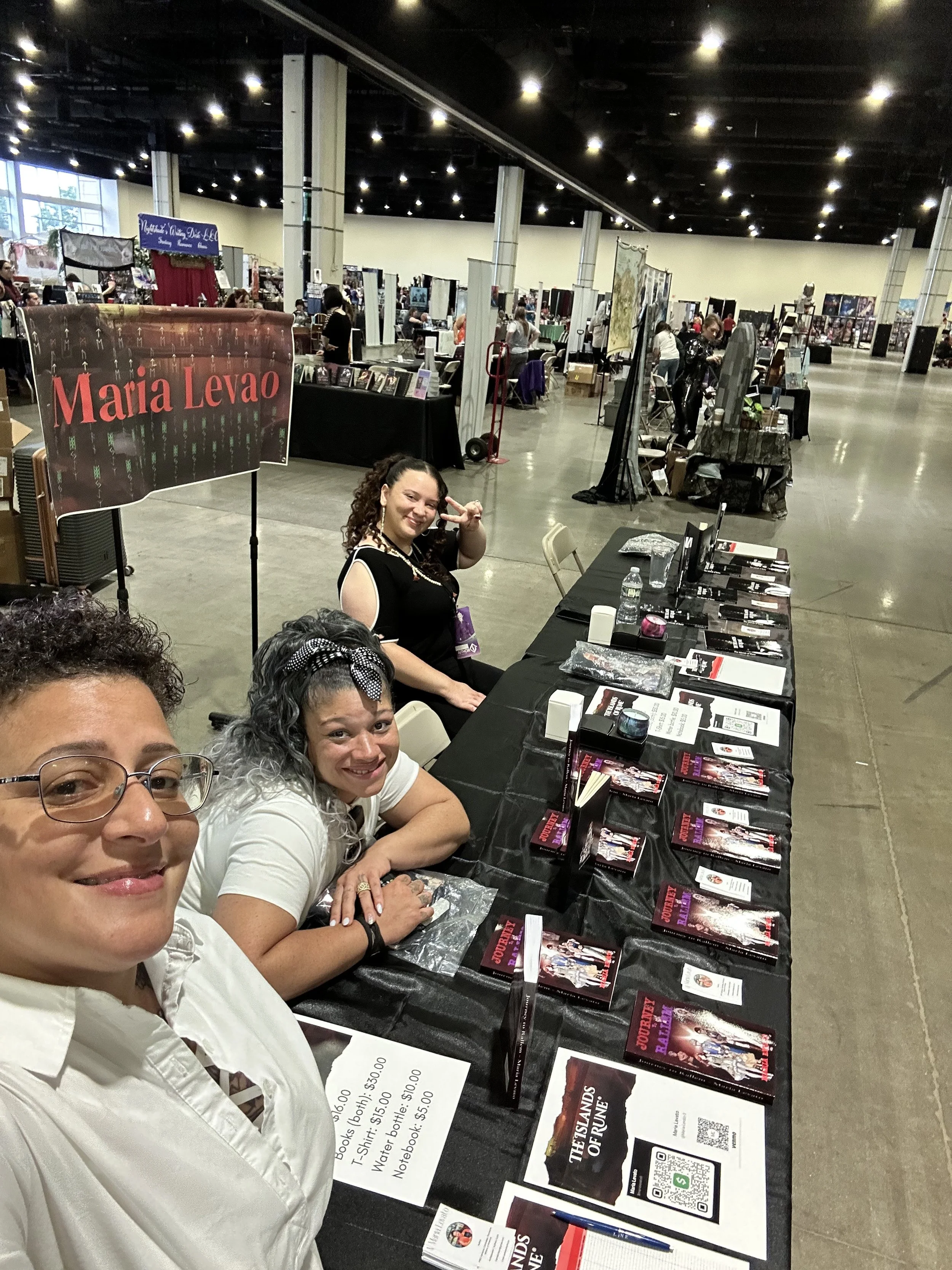 Author Maria Levato and her staff at her booth during Once Upon a Con