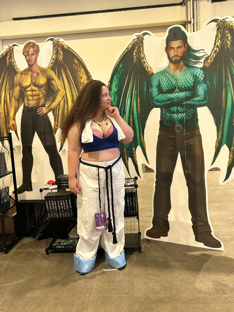 Author Maria Levato taking pictures with another authors display