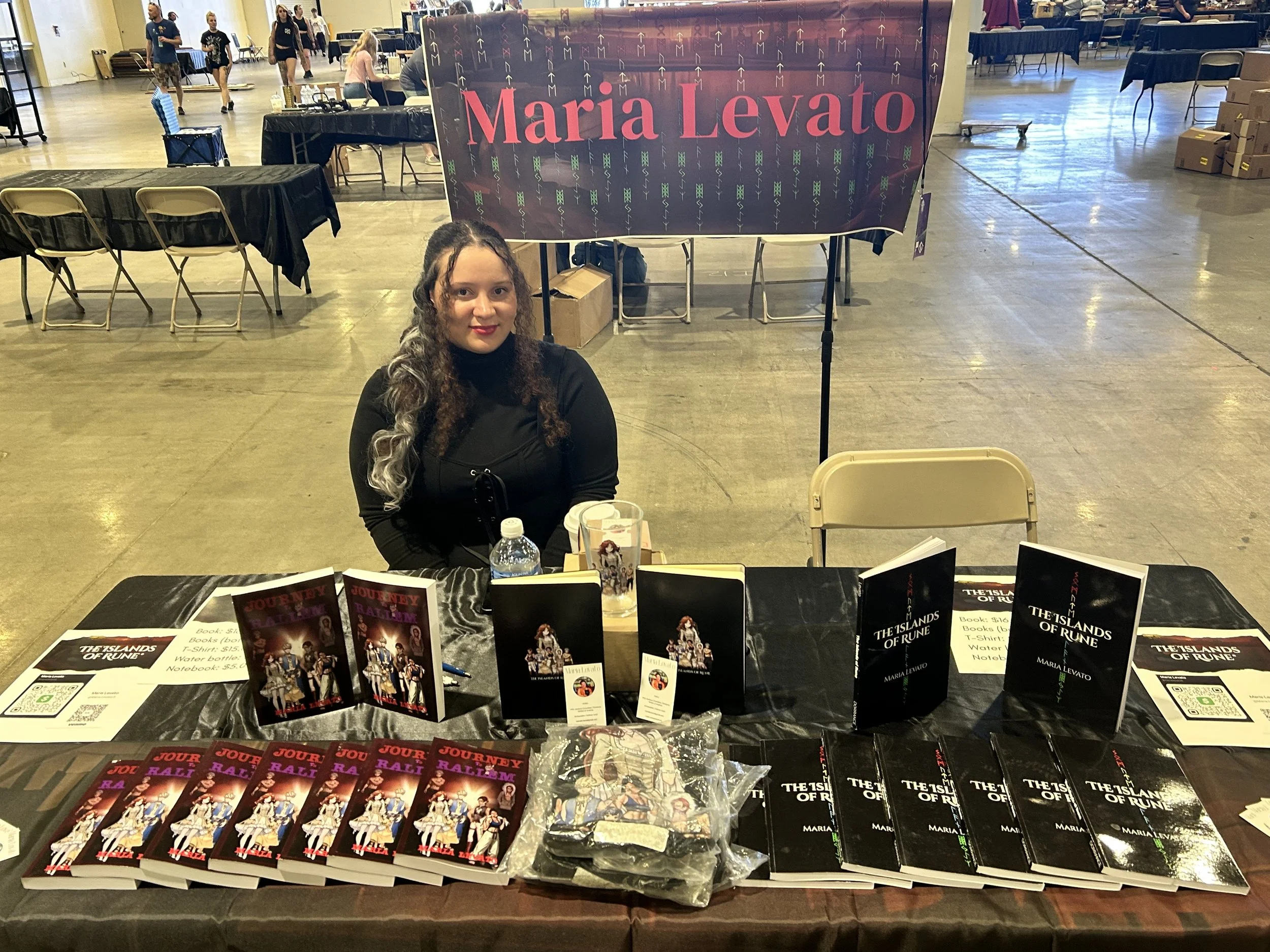 Author Maria Levato at her booth during Once Upon a Con