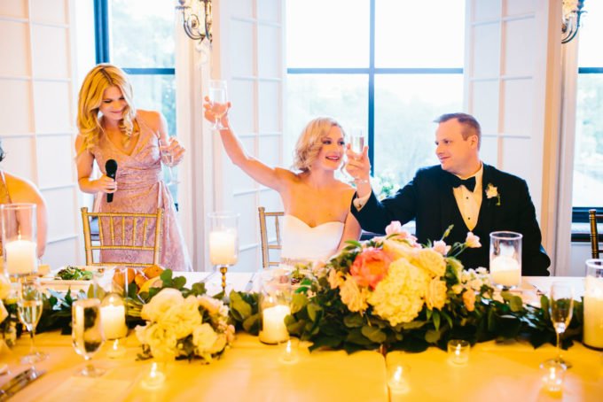 39.-Blackstone-Chicago-Wedding.-Pen-Carlson.-Sweetchic-Events.-bride-and-groom.-maid-of-honor.-toast.-cheers.-garland.-head-table.-680x454.jpg