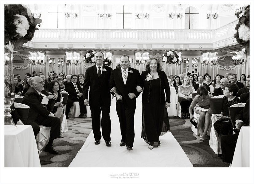 23.-Blackstone-Hotel-Wedding.-Deonna-Caruso-Photography.-Sweetchic-Events.-Groom-and-Parents-Walk-Down-Aisle.jpg