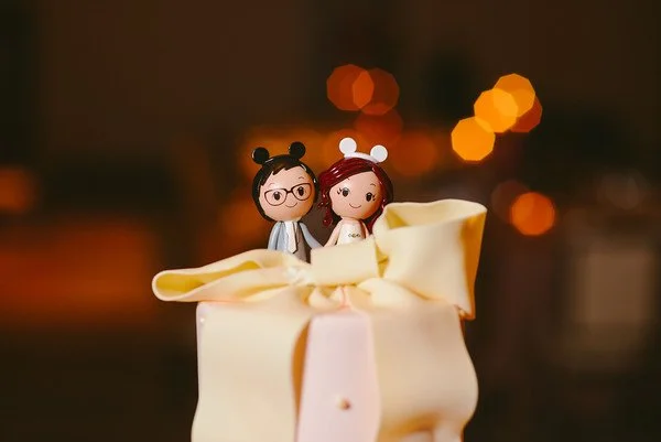 26.-Intercontinental-Ohare-Wedding.-Fragola-Productions.-Sweetchic-Events.-Cake-Topper.-Bride-and-groom-with-mickey-mouse-ears..jpg