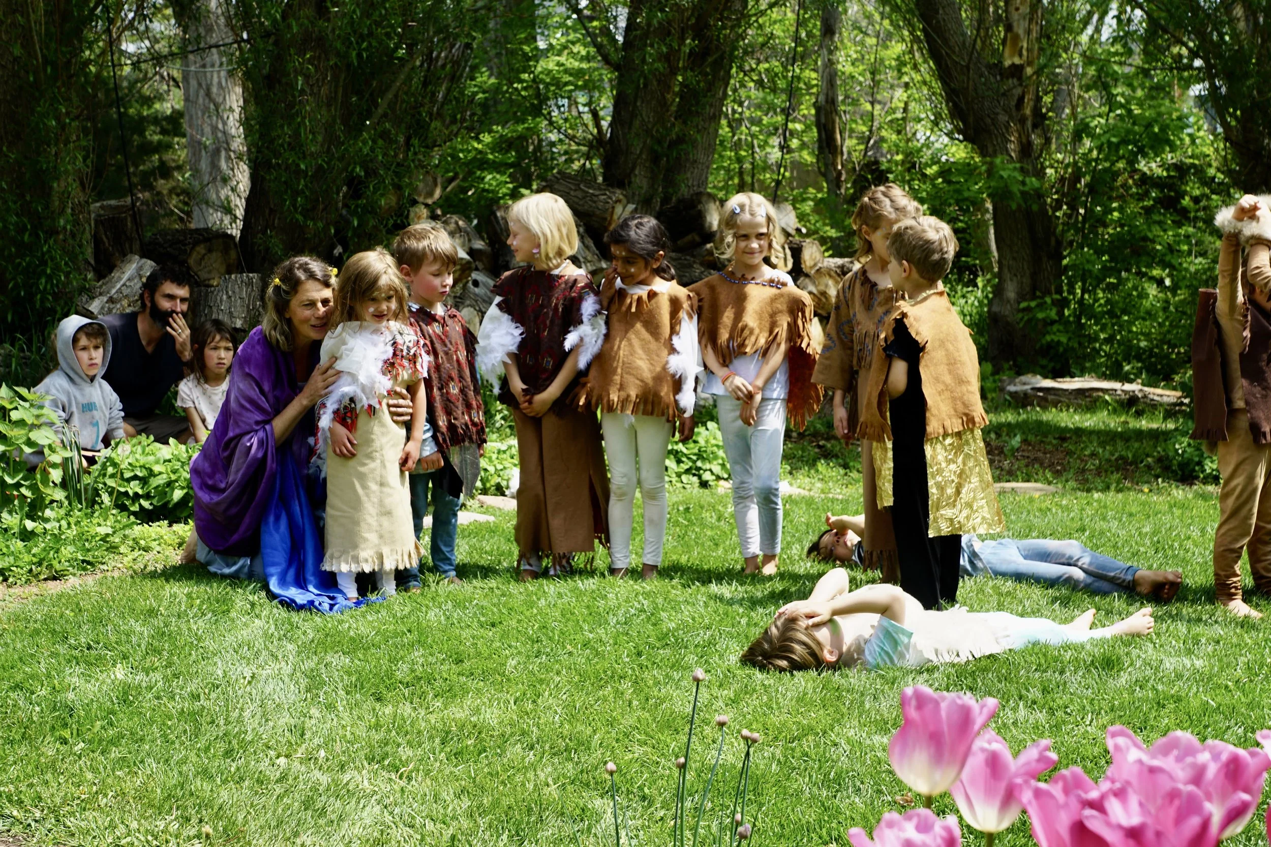 Children dressed in costumes participating in an outdoor play at Sage Programs in Boulder CO.