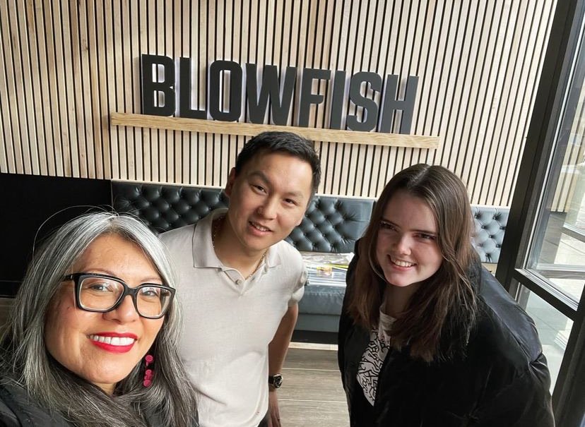 Ald. Manaa-Hoppenworth and team pose for a selfie with the owner of Blowfish inside their new restaurant space