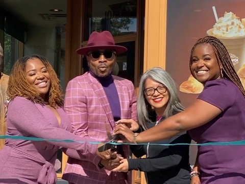 Ald. Manaa-Hoppenworth helps the owners of Sip &amp; Savor cut the ribbon for their Bryn Mawr location.