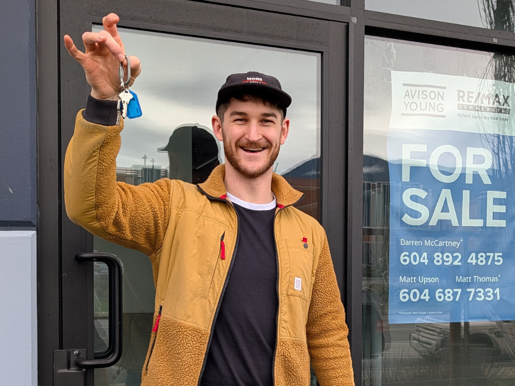 Oscar, the owner, holding the keys to the new space.