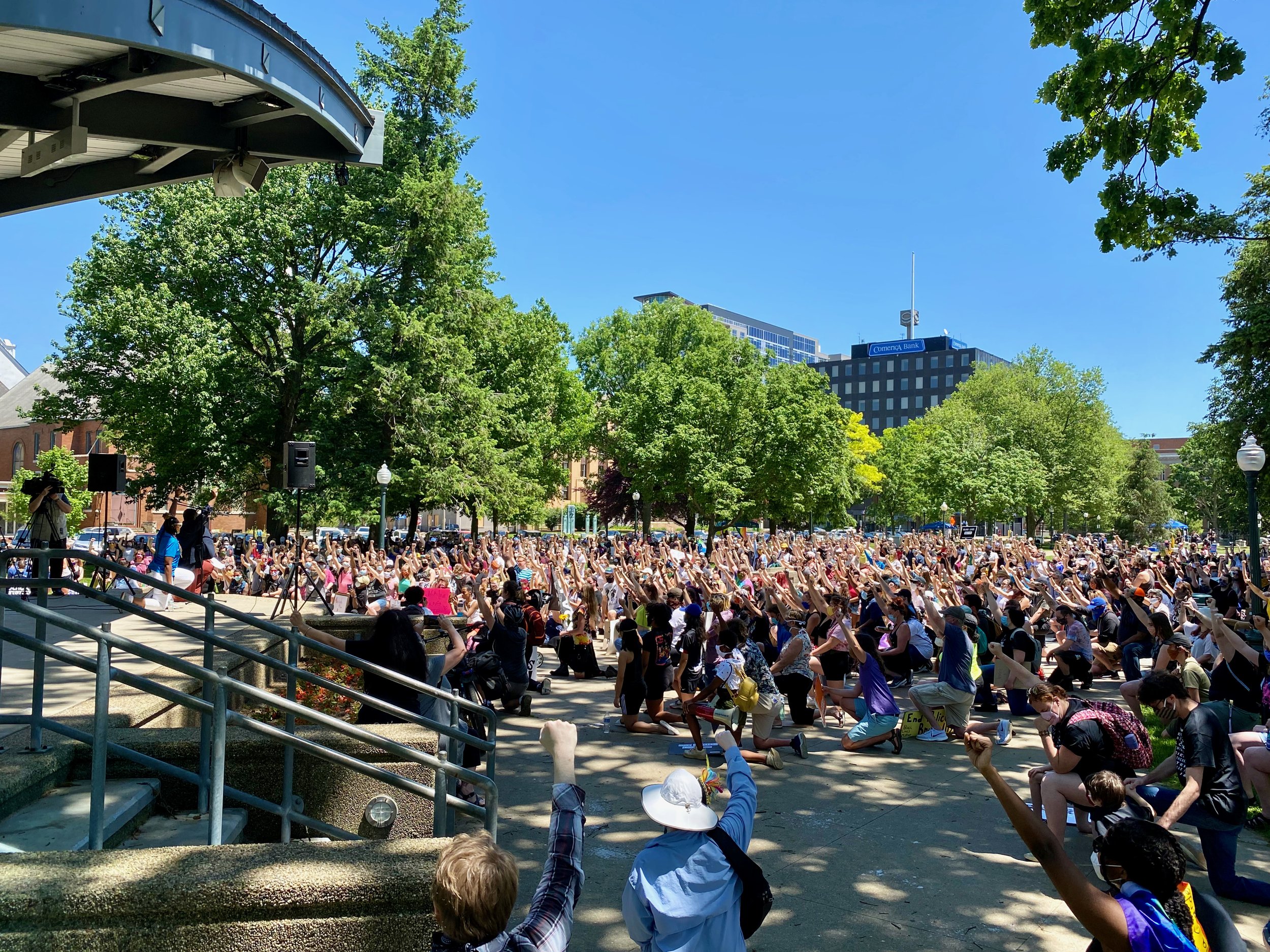 Hundreds of people take a knee at Bronson Park during a racial justice rally on June 6, 2020.