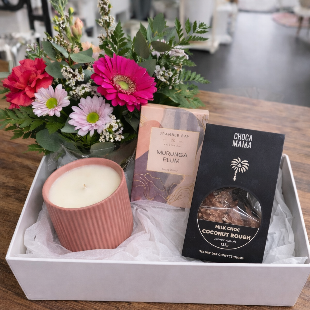 Gift box with soap, candle, and treats.png