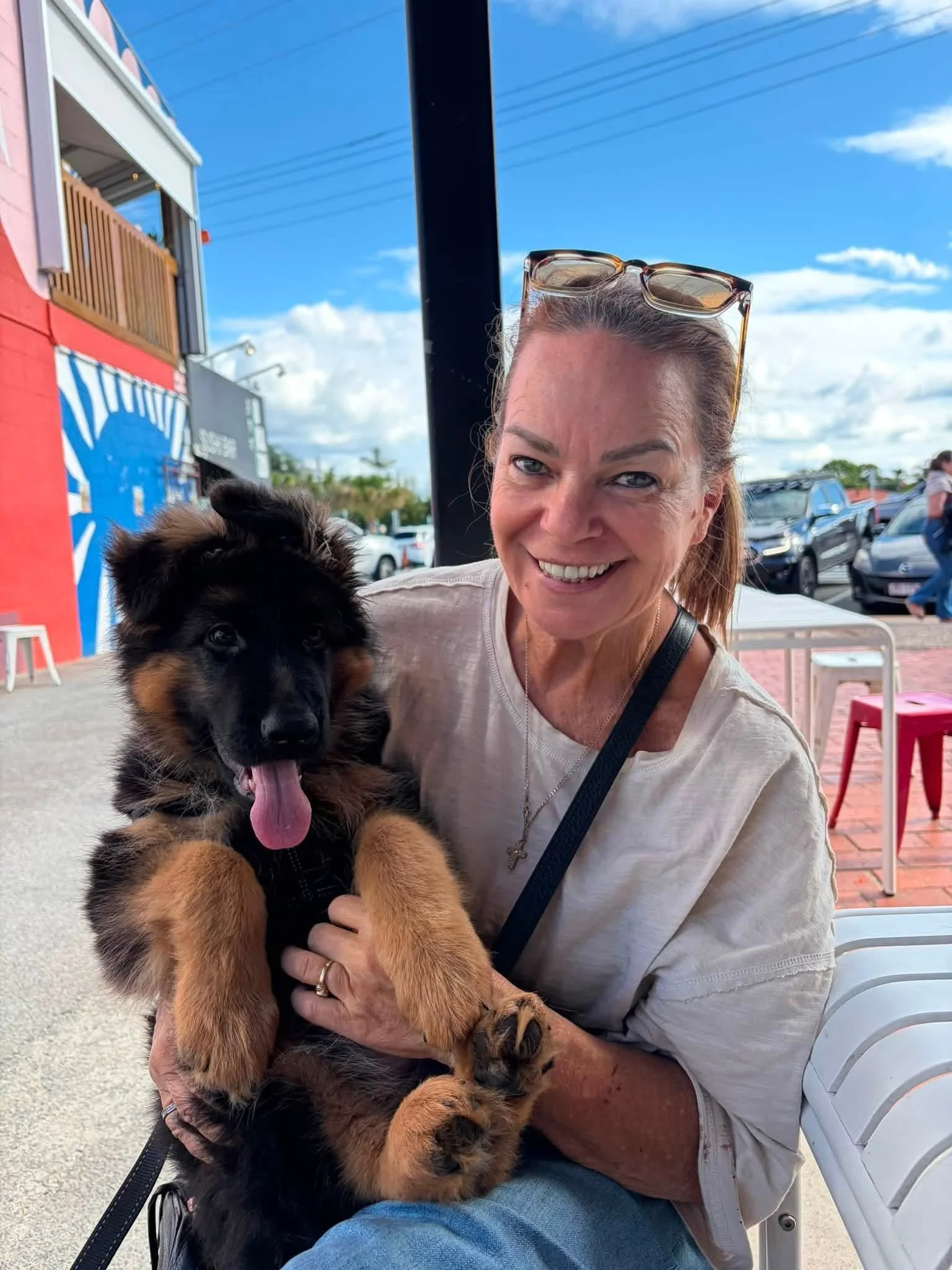 Bindi (pink girl) enjoying coffee and sunshine with her Mum