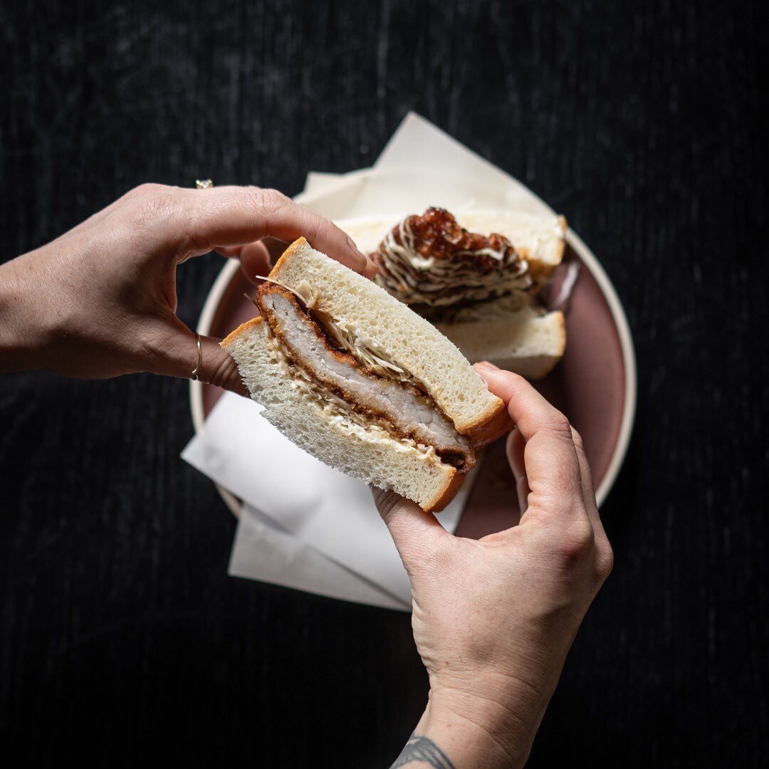 Our Katsu Sando is a traditional Japanese sandwich that typically comprises crumbed pork cutlets, enveloped between two slices of soft, white bread, and embellished with a range of toppings, including tonkatsu sauce and mayonnaise.