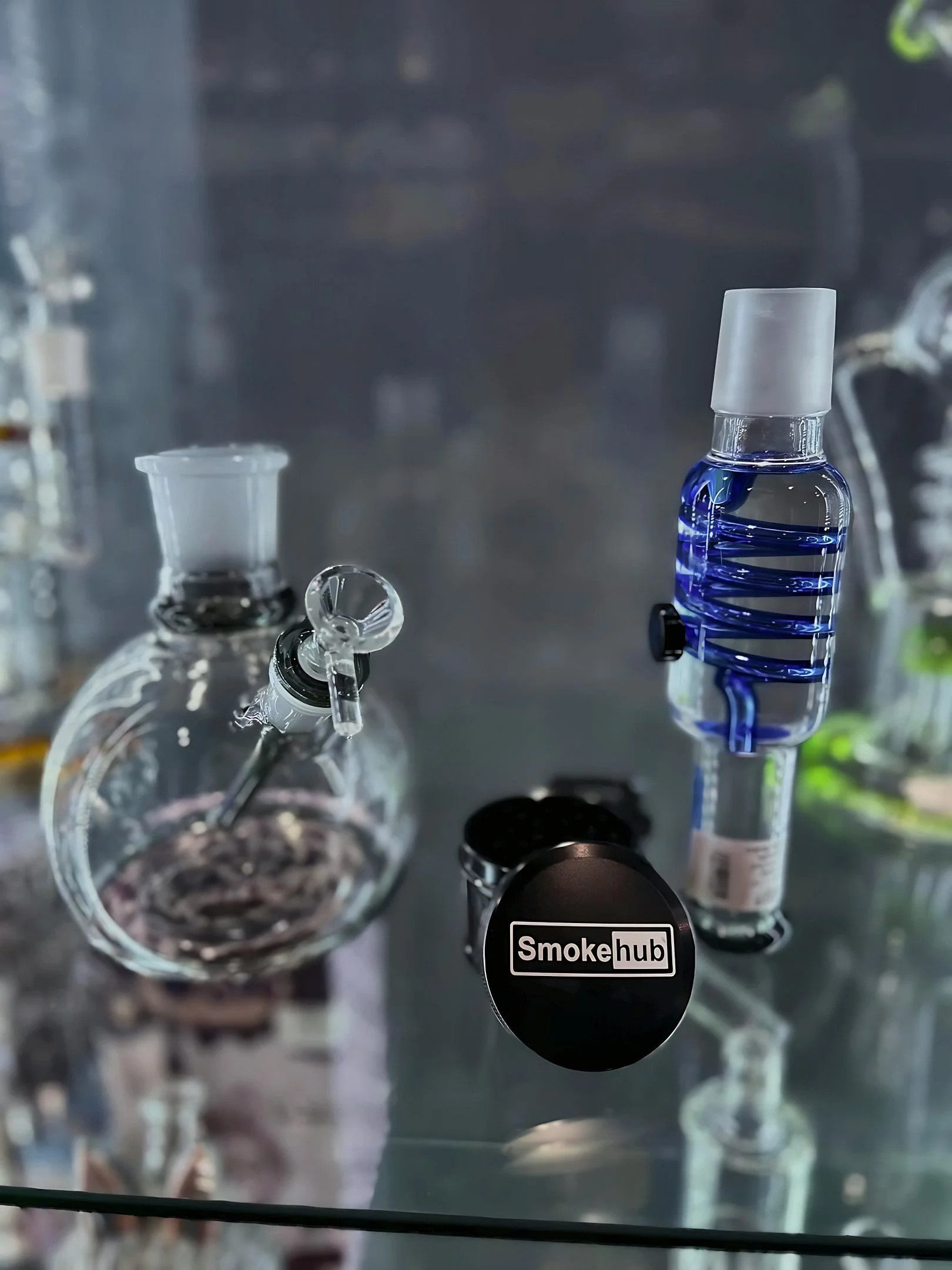 Glass water pipe and Smoke Hub grinder on display in Tinley Park