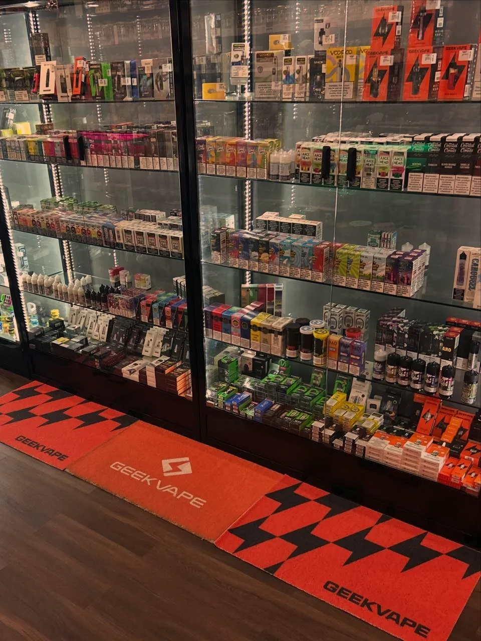 Vape juice and e-liquid display cabinet at Smoke Hub vape shop in Tinley Park