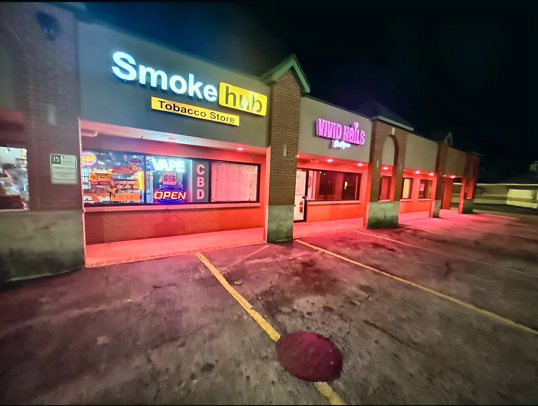 Smoke Hub vape and smoke shop storefront at night, 16650 Oak Park Ave, Tinley Park IL