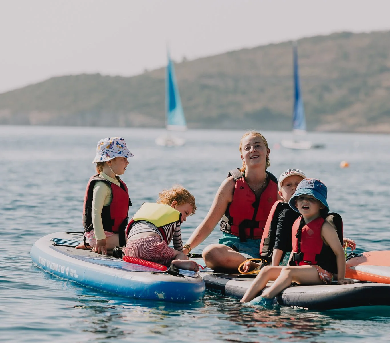 kids on paddle boards having fun