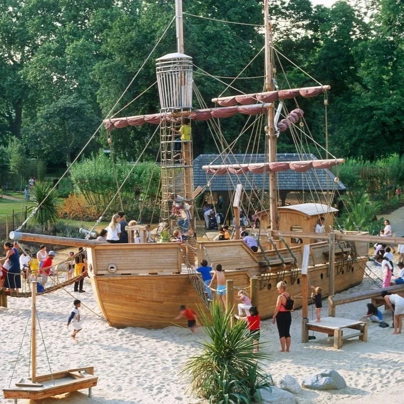 Children playing on the famous pirate ship at the Diana Memorial Playground in Kensington Gardens, London.