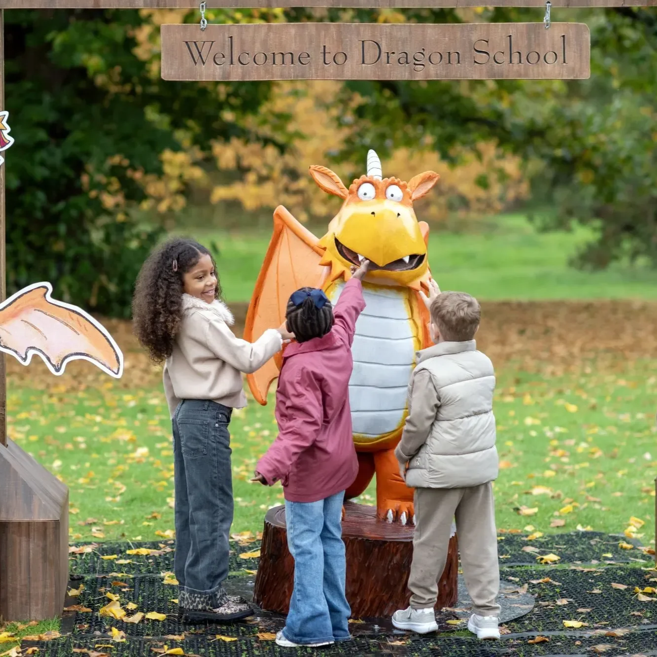 Children meeting a dragon character during Kew Gardens