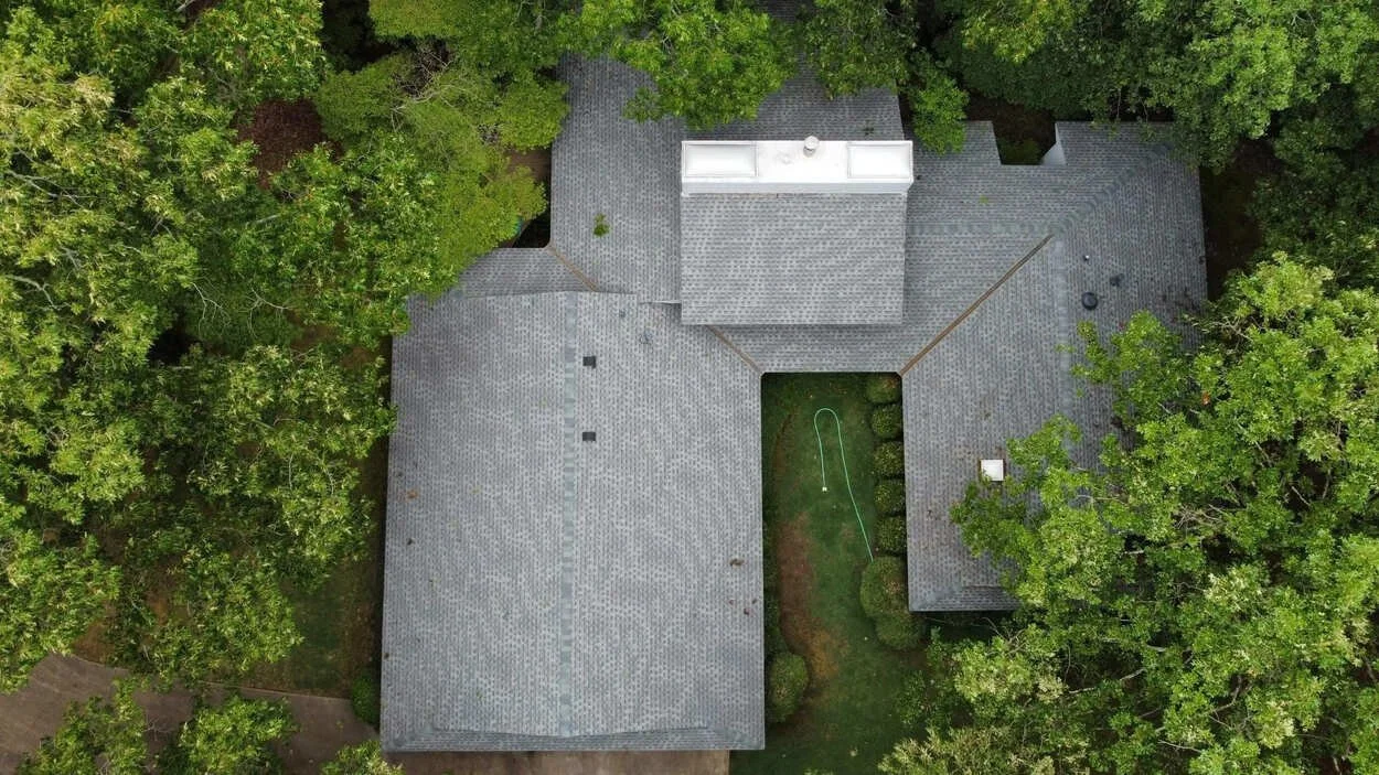 A newly installed gray shingle roof