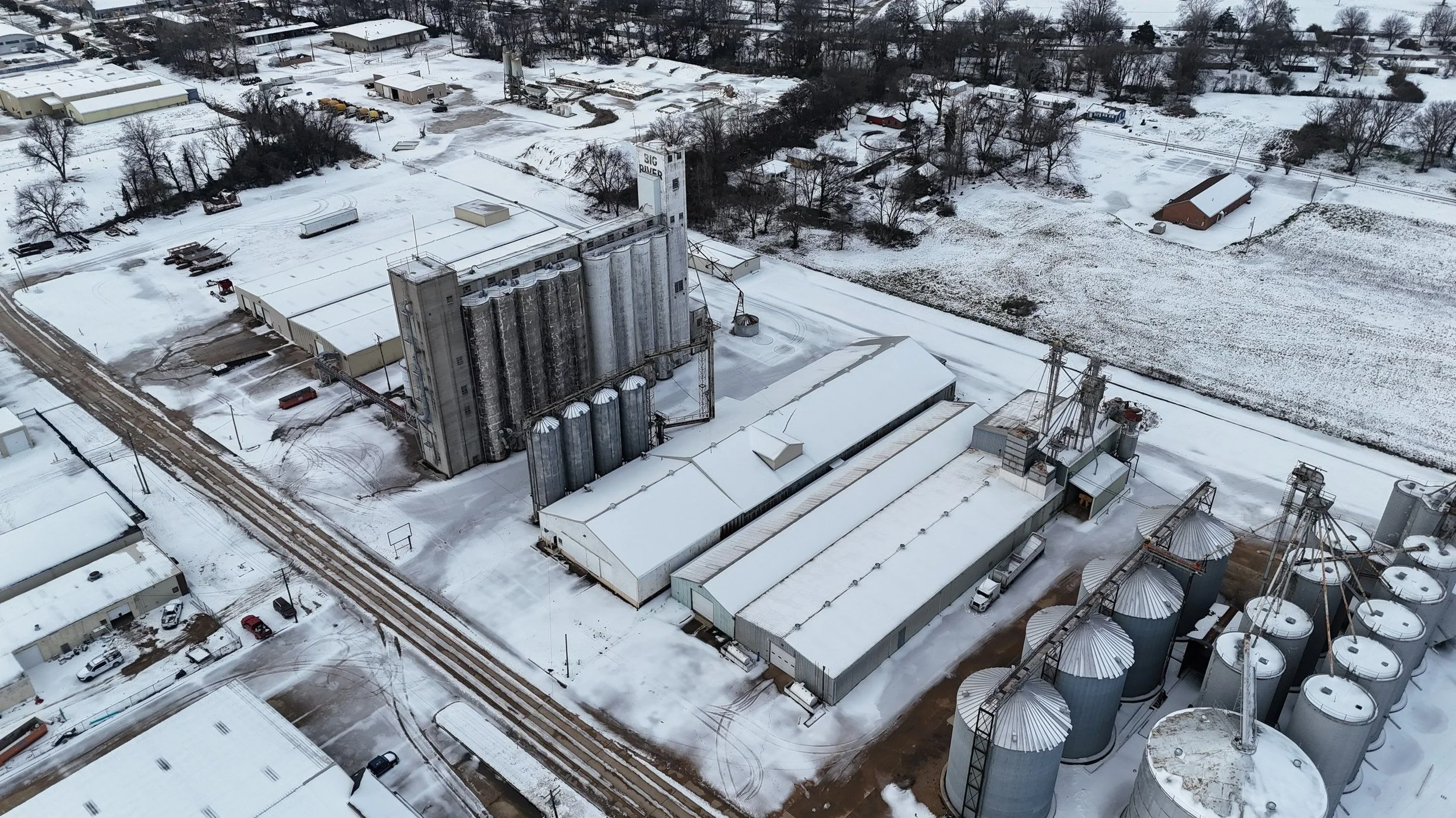 Ice Dams on Commercial Flat and Metal Roofs: What They Are, How They Cause Leaks, and What to Do About Them