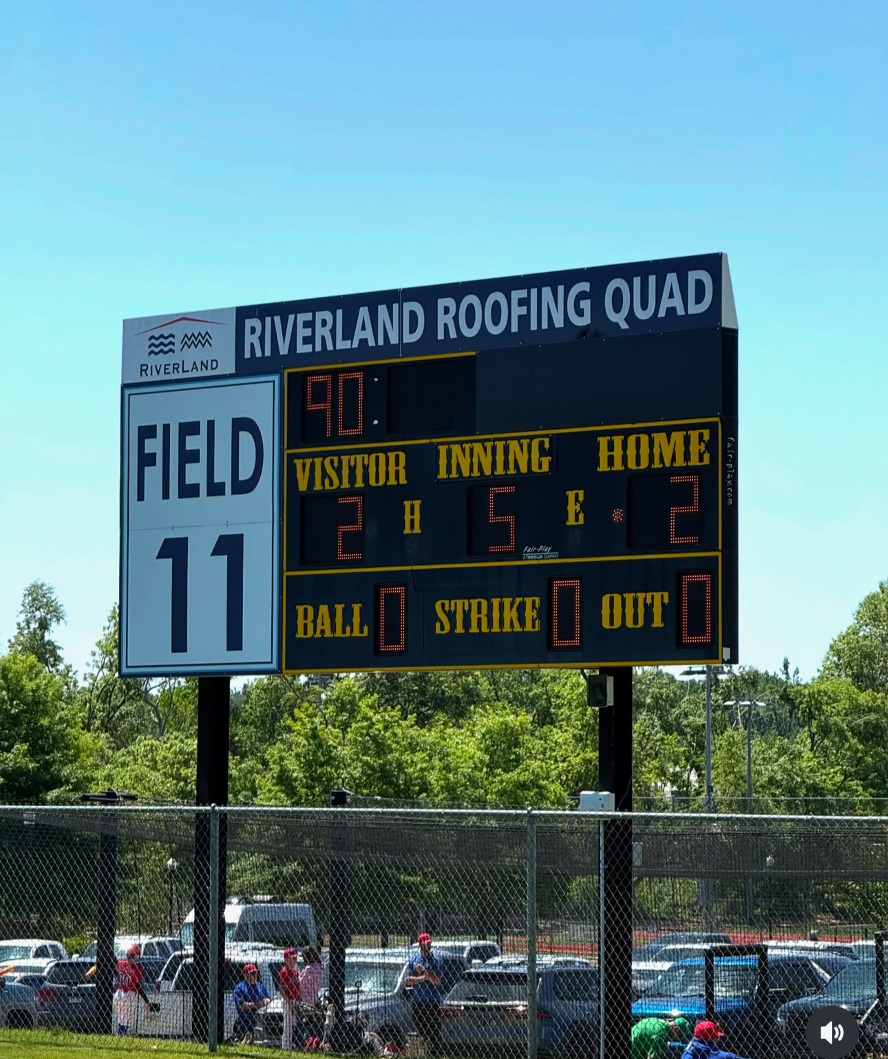 The scoreboard at MTrade Park with the RiverLand Roofing Quad and logo on top