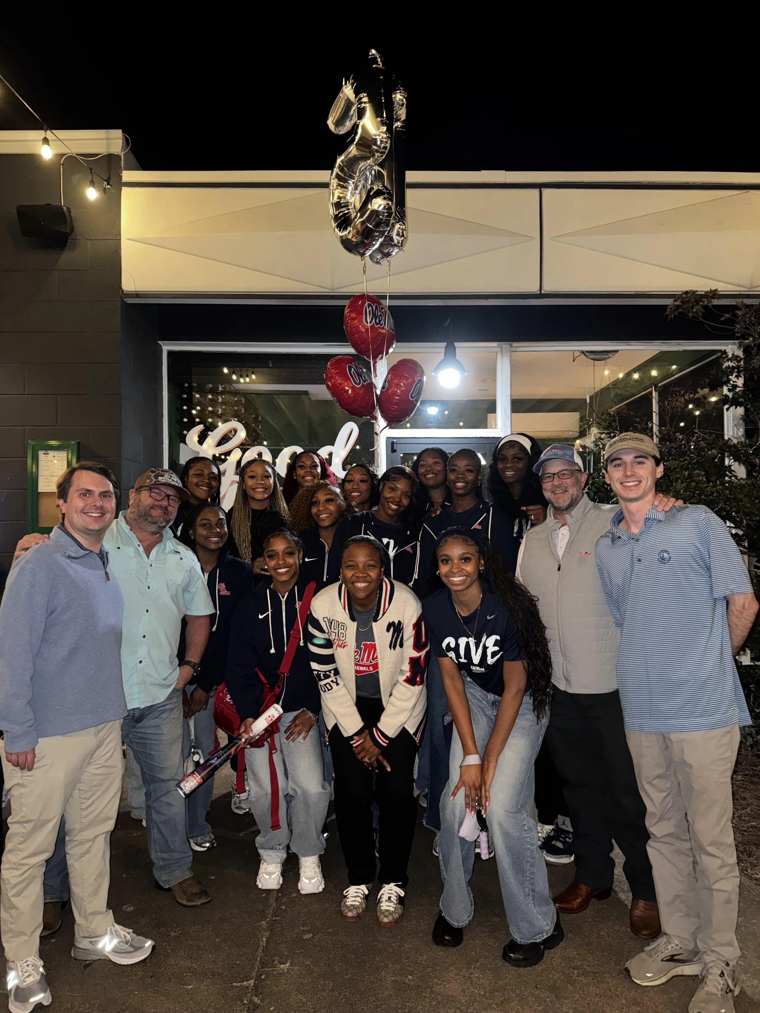 A group of people at the ole miss WBB tip off party