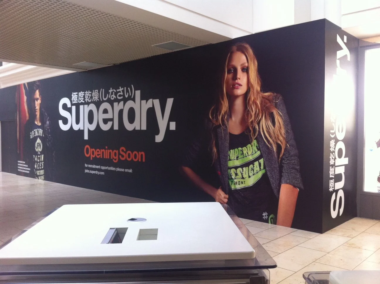 Superdry new store hoarding.JPG