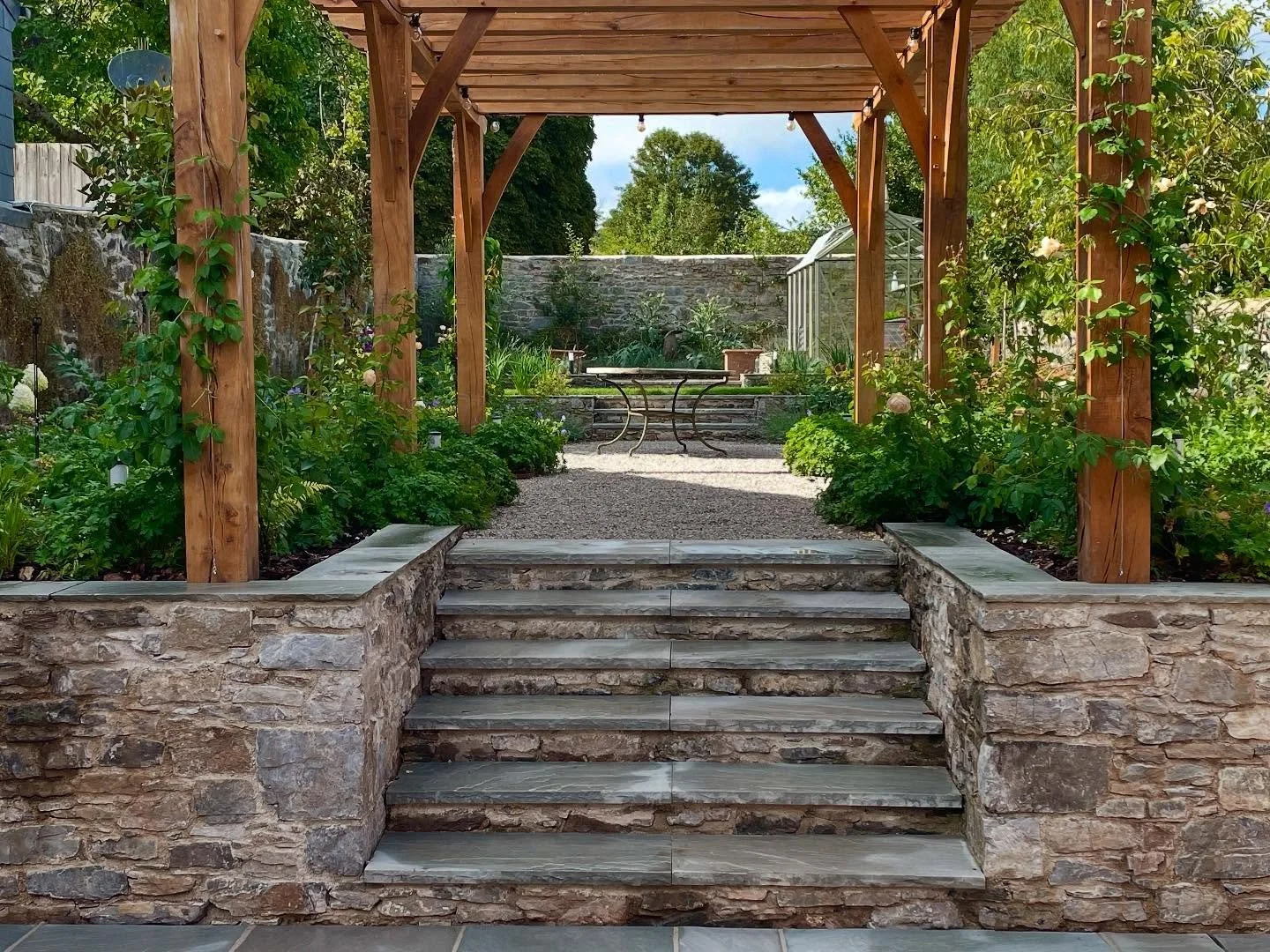 A quick before and after of the Ashburton walled garden project&hellip;still waiting for the furniture, but the new planting is really beginning to settle in and the @david_austin_roses are now winding up the locally harvested oak pergola by @bowden_