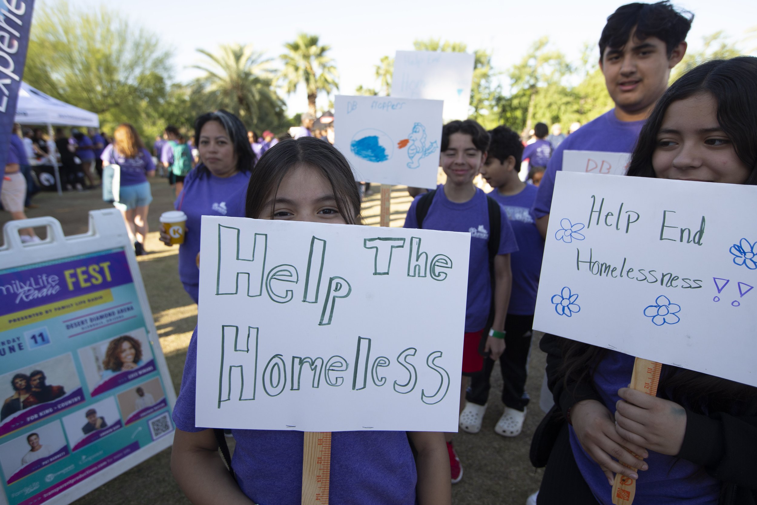 walkers with signs 16- zoo walk 2023 - photo credit - Dave Seibert PHX Zoo.JPG
