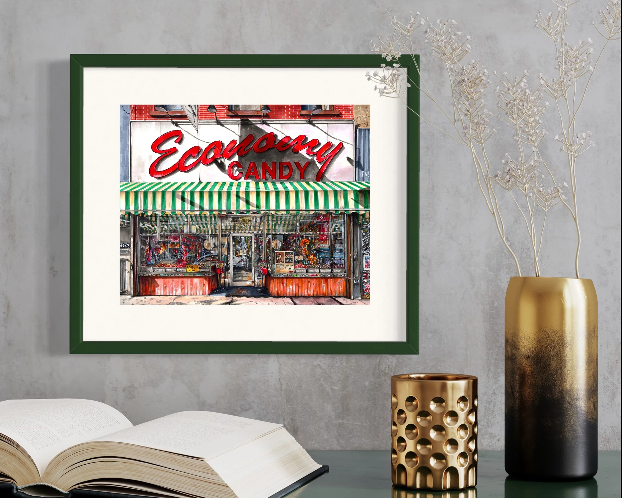 Framed in dark green, this hand-illustrated drawing of Economy Candy print hangs on the wall