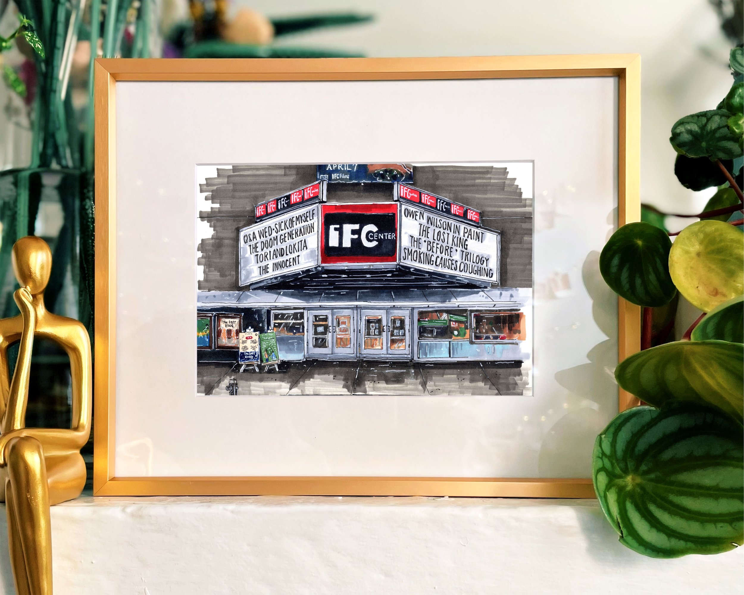 Framed in gold, this hand-illustrated drawing of IFC print sits on a mantelpiece