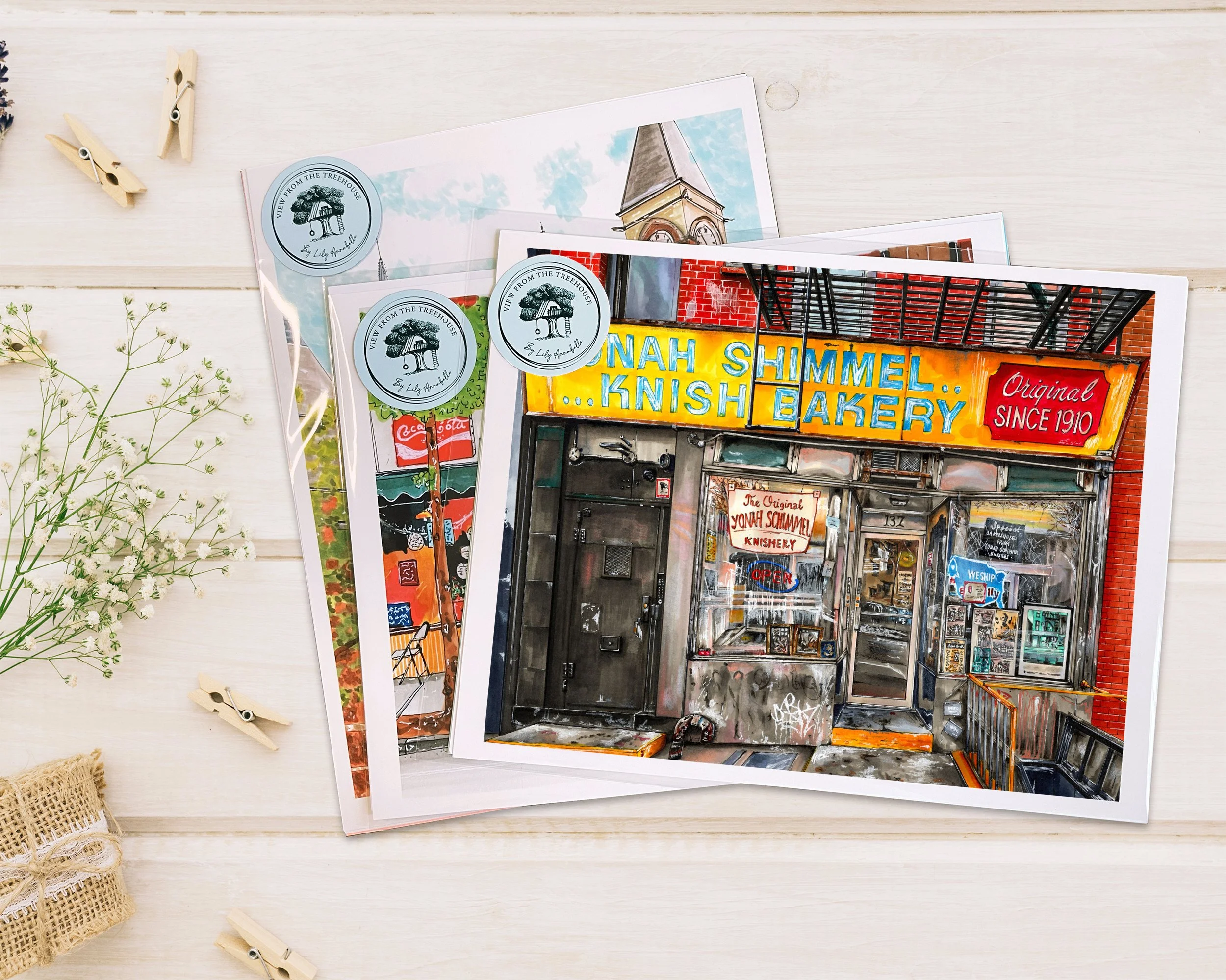 Hand-drawn Yonah Schimmel Knish Bakery NYC art print displayed on a wood table