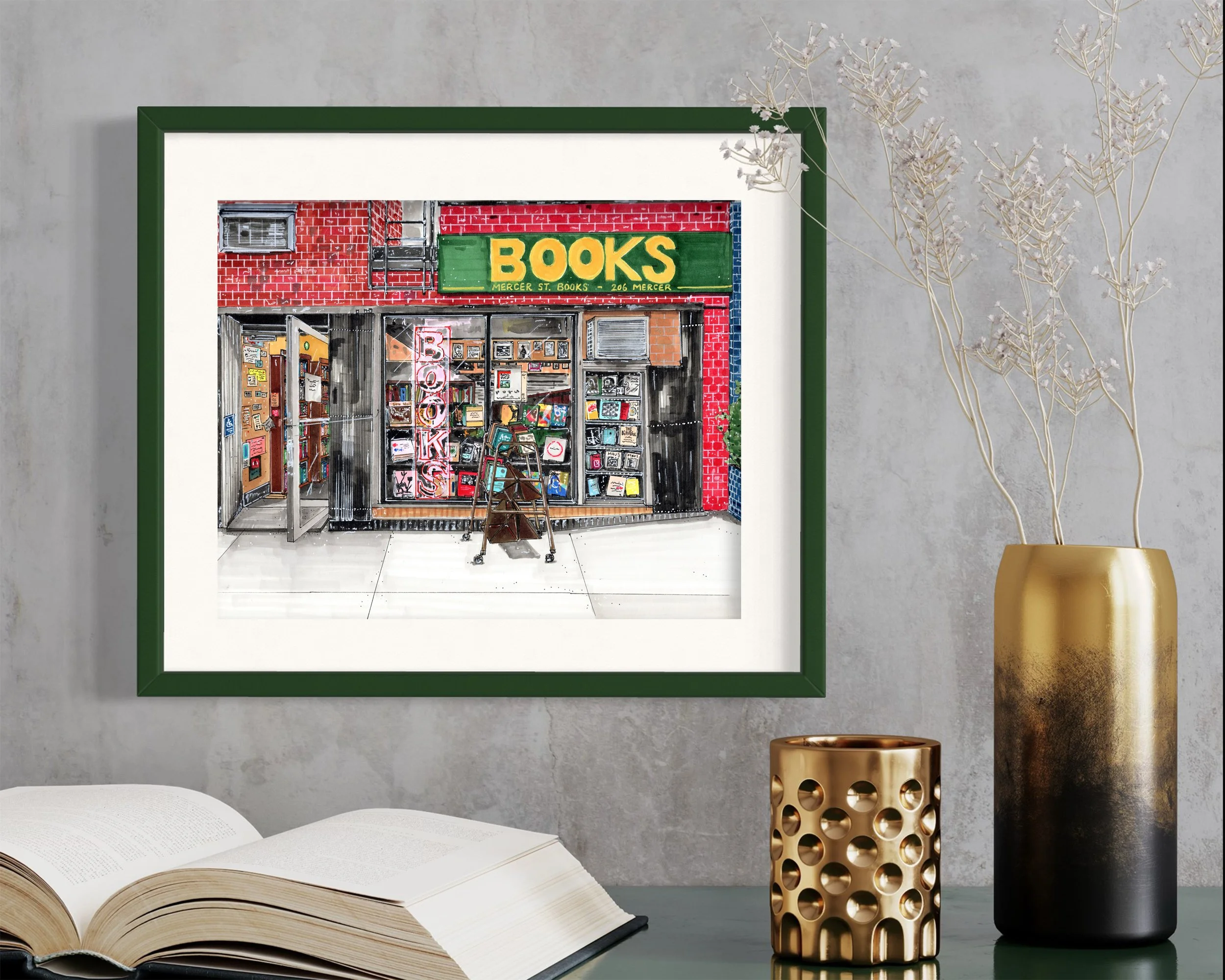 Framed in dark green, this hand-illustrated drawing of Mercer St Books and Records print hangs on the wall