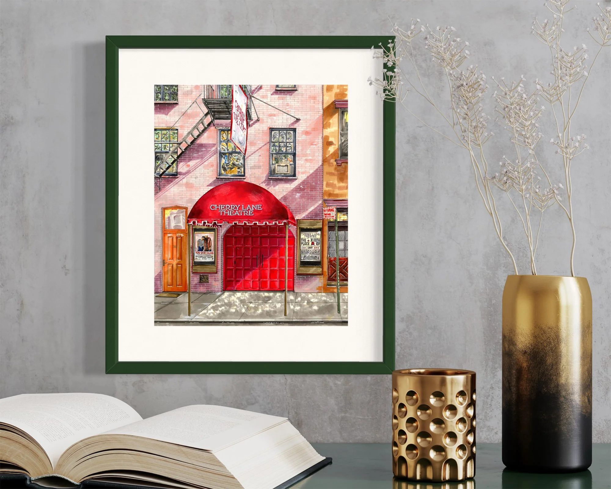 Framed in dark green, this hand-illustrated drawing of Cherry Lane Theatre print hangs on the wall