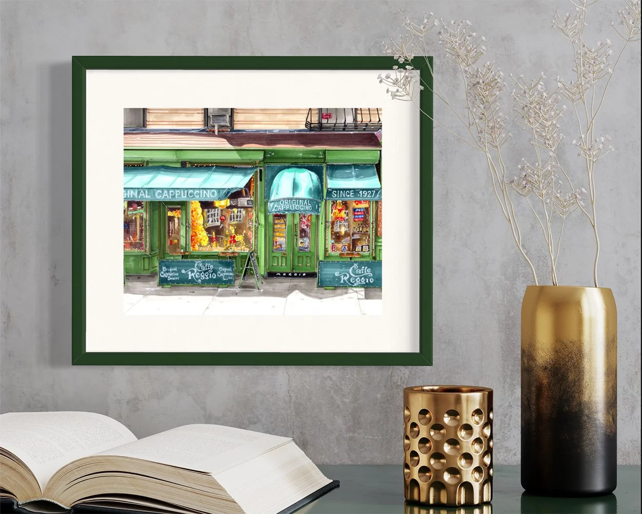 Framed in dark green, this hand-illustrated drawing of Caffe Reggio print hangs on the wall