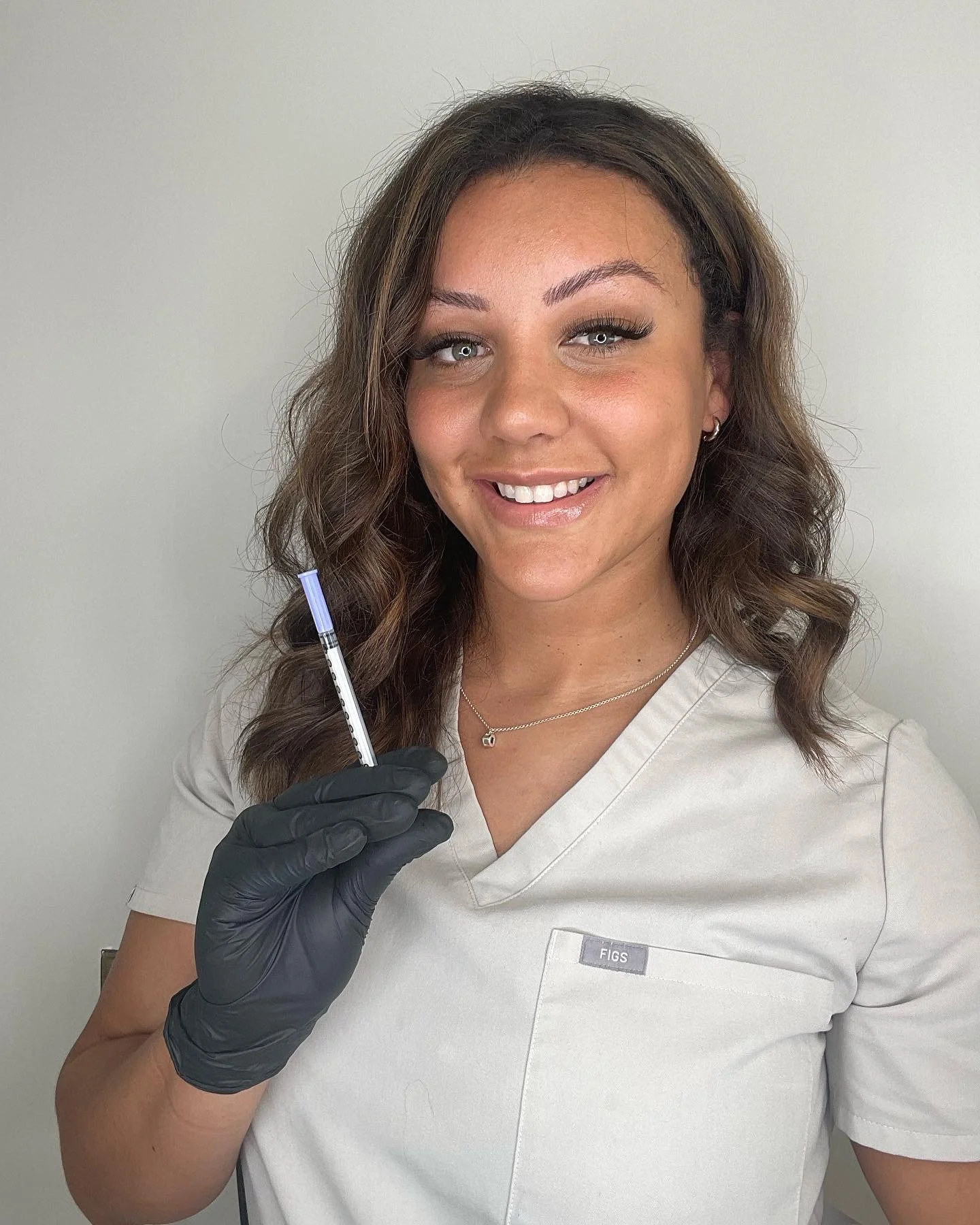 Nurse Sonia in aesthetics clinic in Stafford smiling at camera