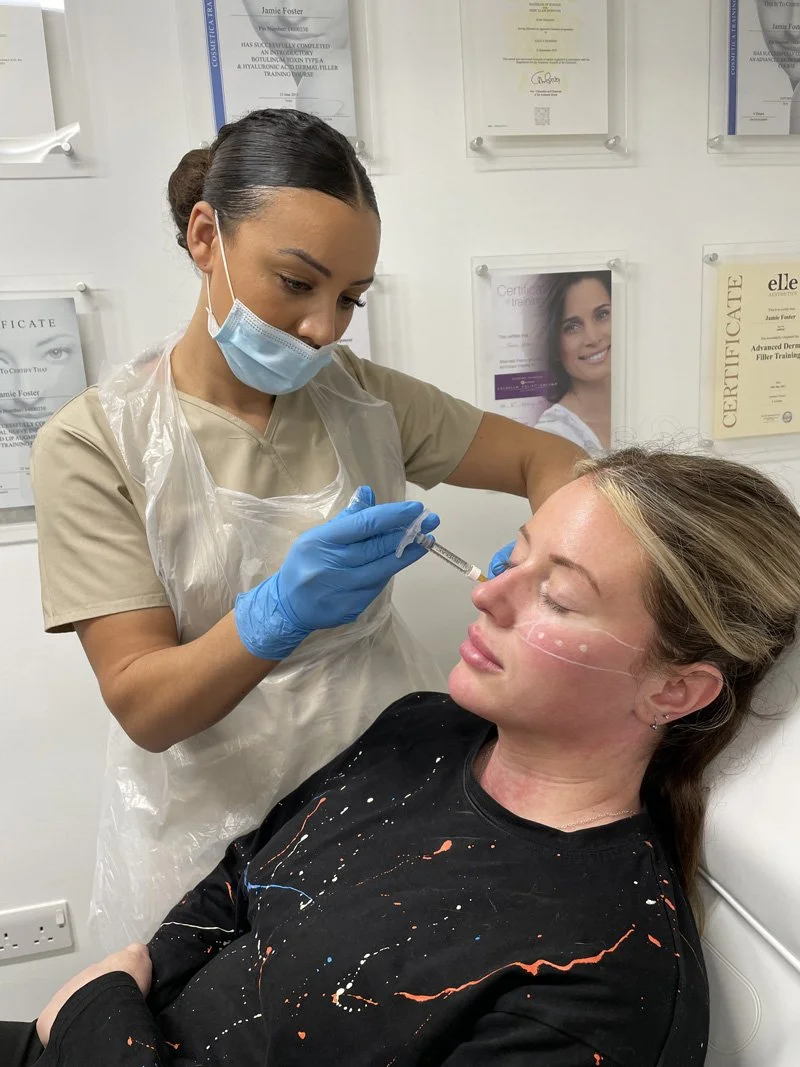 Woman in aesthetics clinic receiving treatment