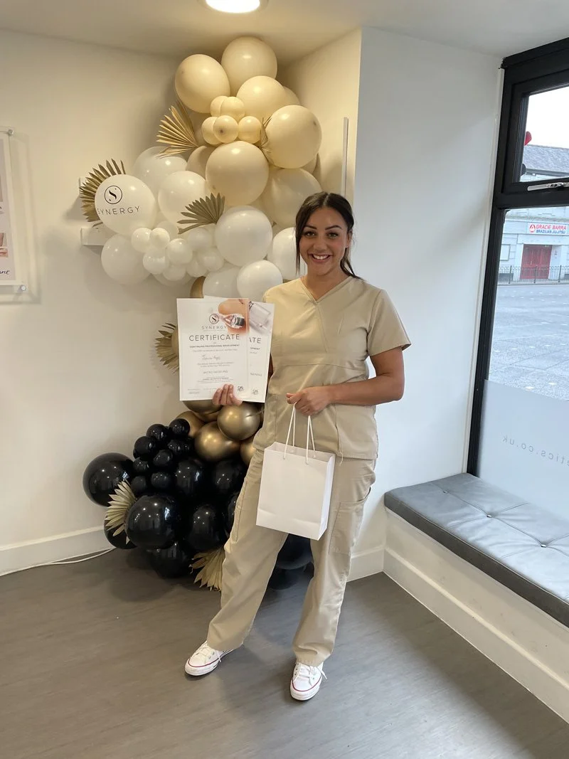 Aesthetics and skincare nurse receiving qualification certificate