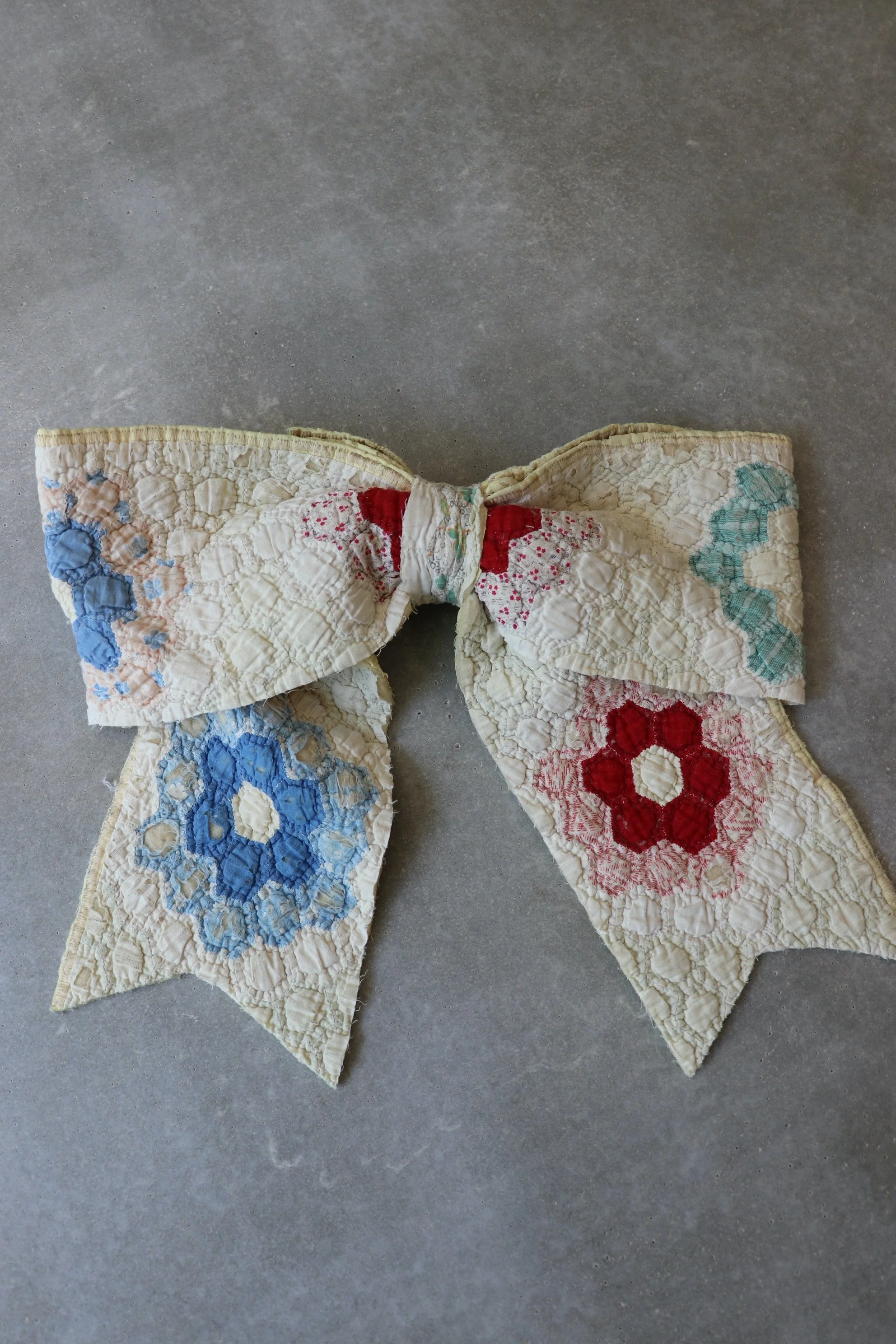Grandmother's Flower Garden Quilted Bow Circa 1930s–1940s.