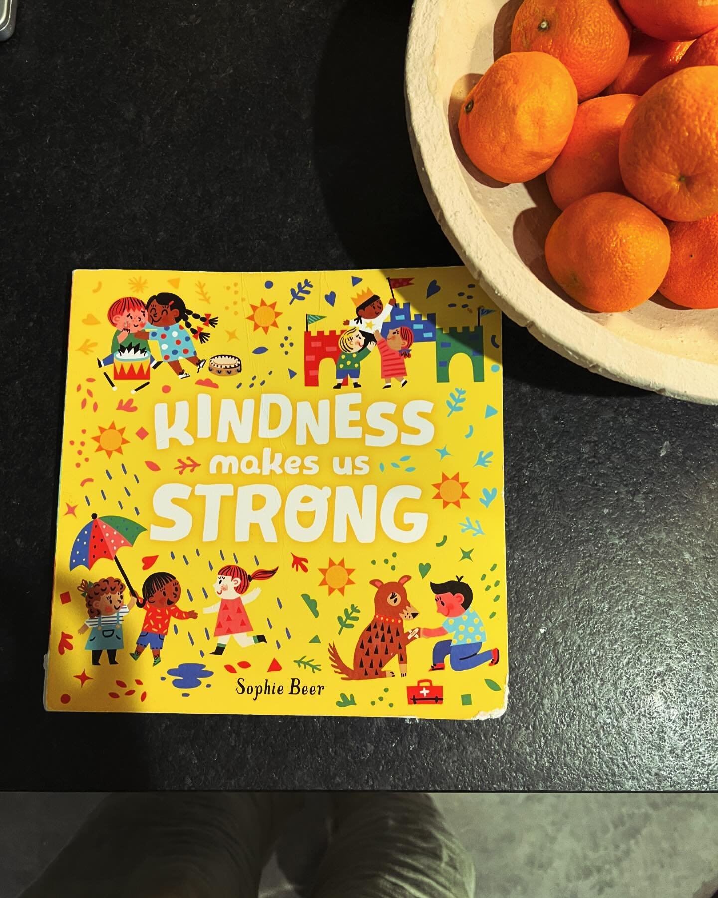 This board book is a little bent and has some dried snacks (&ldquo;na na&rdquo;) on some of its pages as a testament to how beloved it is to the twins. It&rsquo;s full of things they are learning like sharing, taking turns, showing care, and being pa