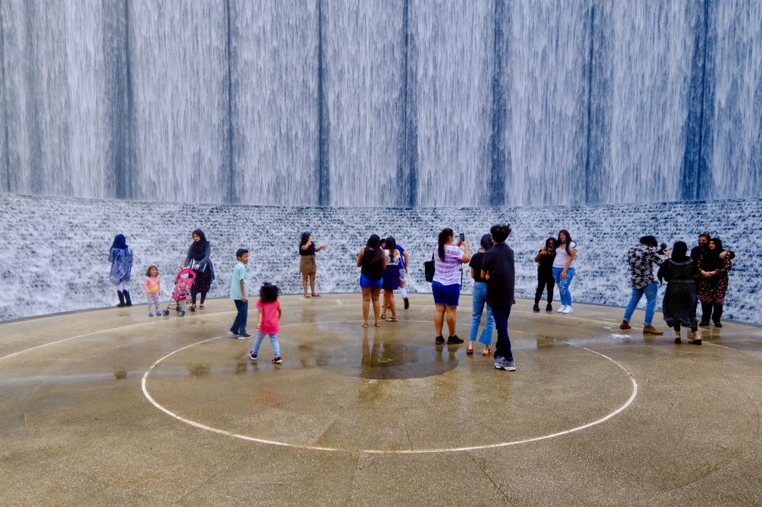 People-at-cascading-water-Waterwall-Park-resized-1536x1023.jpg