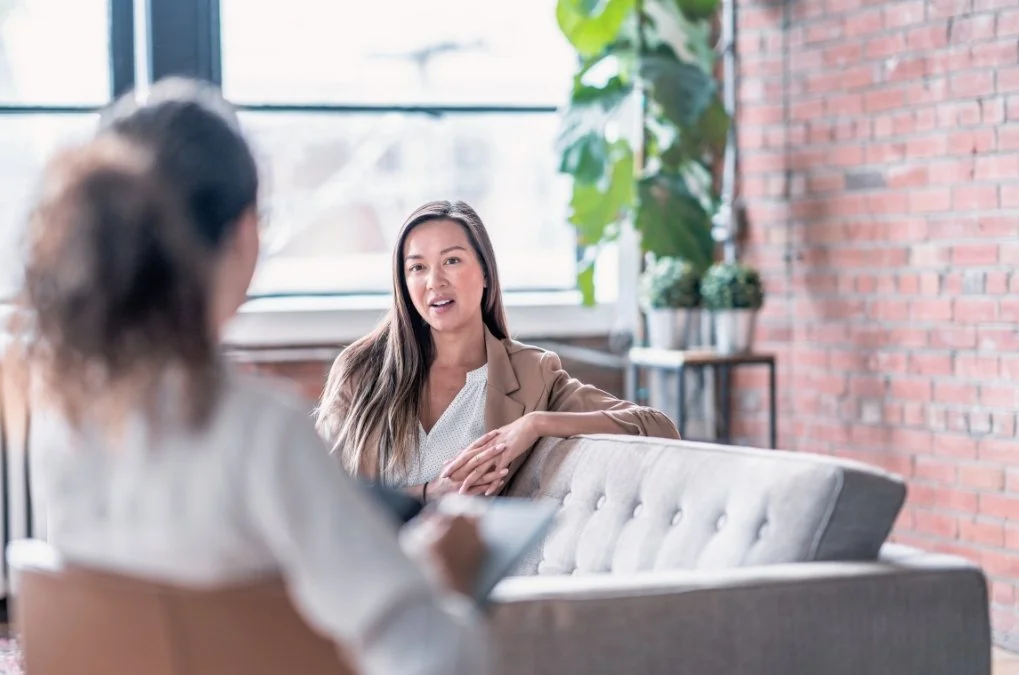 Woman talking during a therapy session.