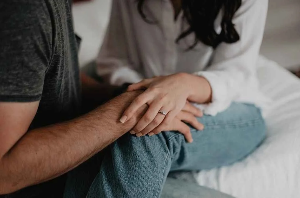 Couple holding hands.