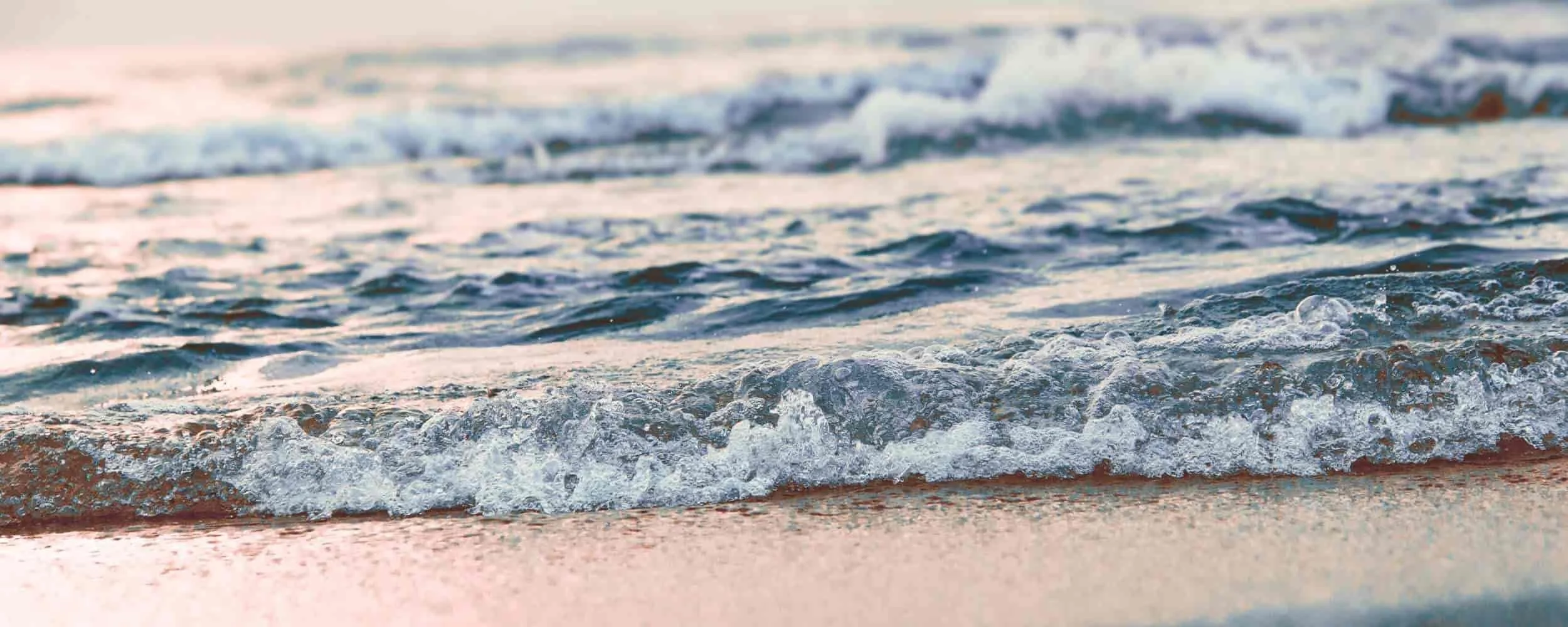 Gentle ocean waves background for the section: We Balance Deep Insight With Practical Tools