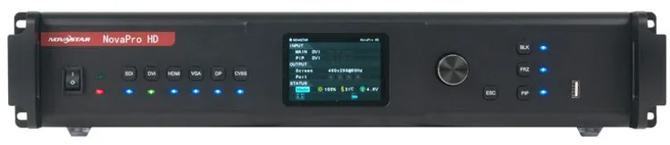 A black professional video switcher with a small digital display, various labeled buttons, and indicator lights.